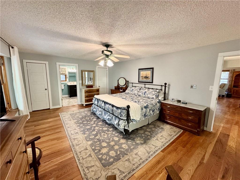 1012 King Mill Road McDonough, GA 30252 - Photo 18 of 64 a spacious bedroom with a bed and a dresser in it