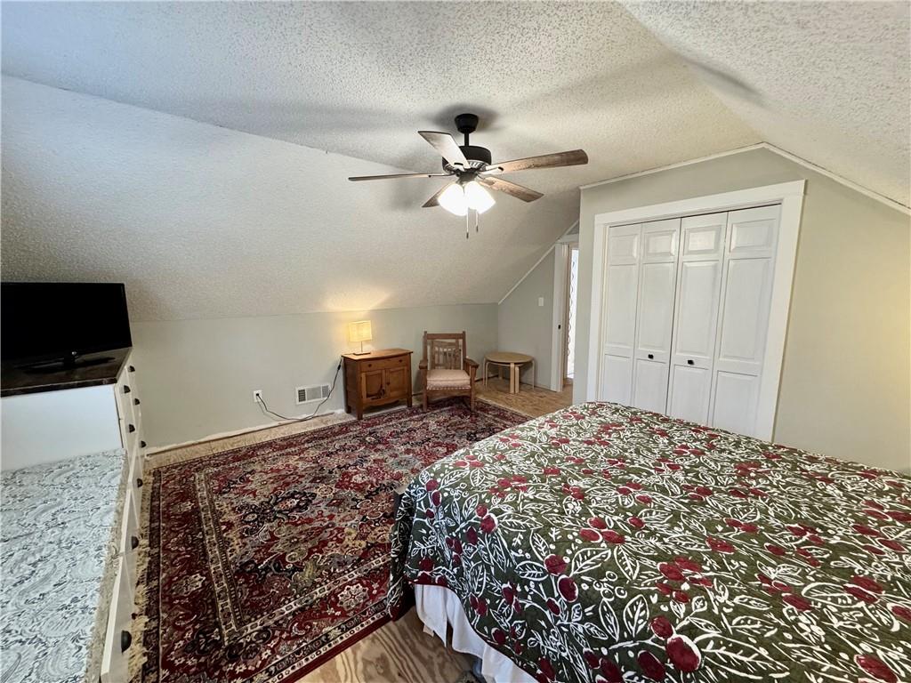 1012 King Mill Road McDonough, GA 30252 - Photo 28 of 64 a bedroom with a bed and a chandelier