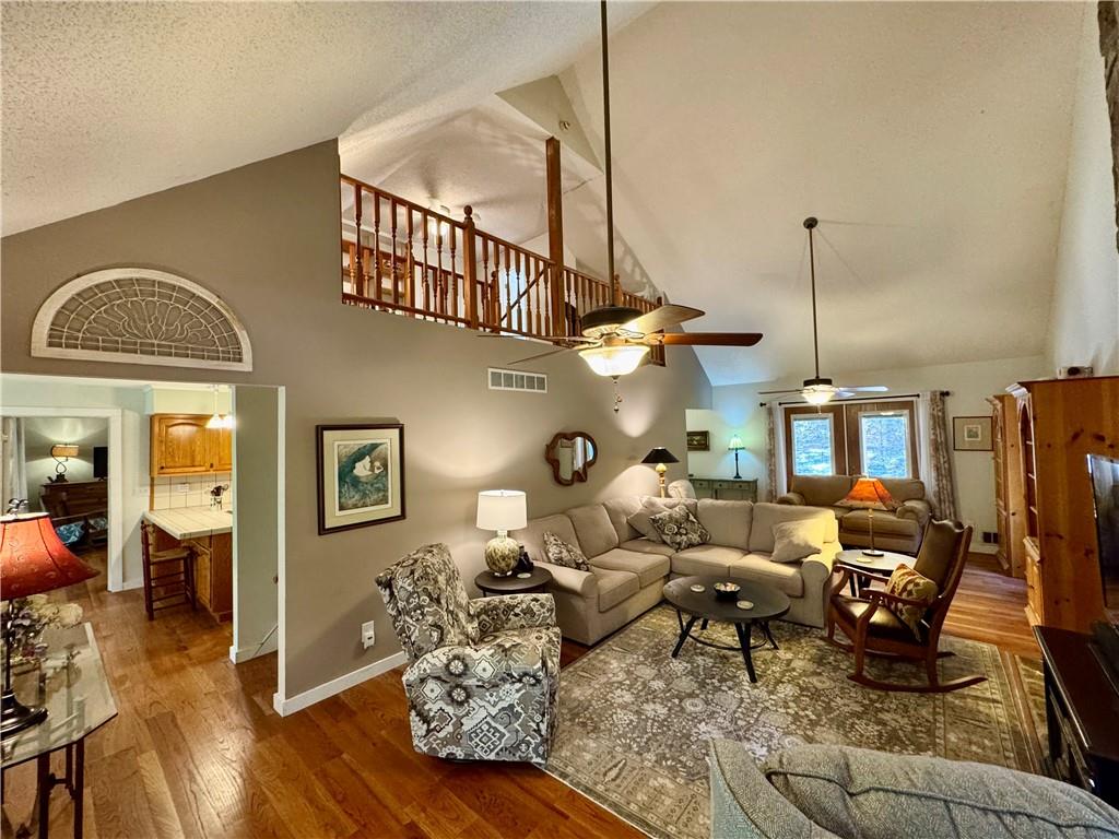 1012 King Mill Road McDonough, GA 30252 - Photo 3 of 64 a living room with furniture a wooden floor and a chandelier