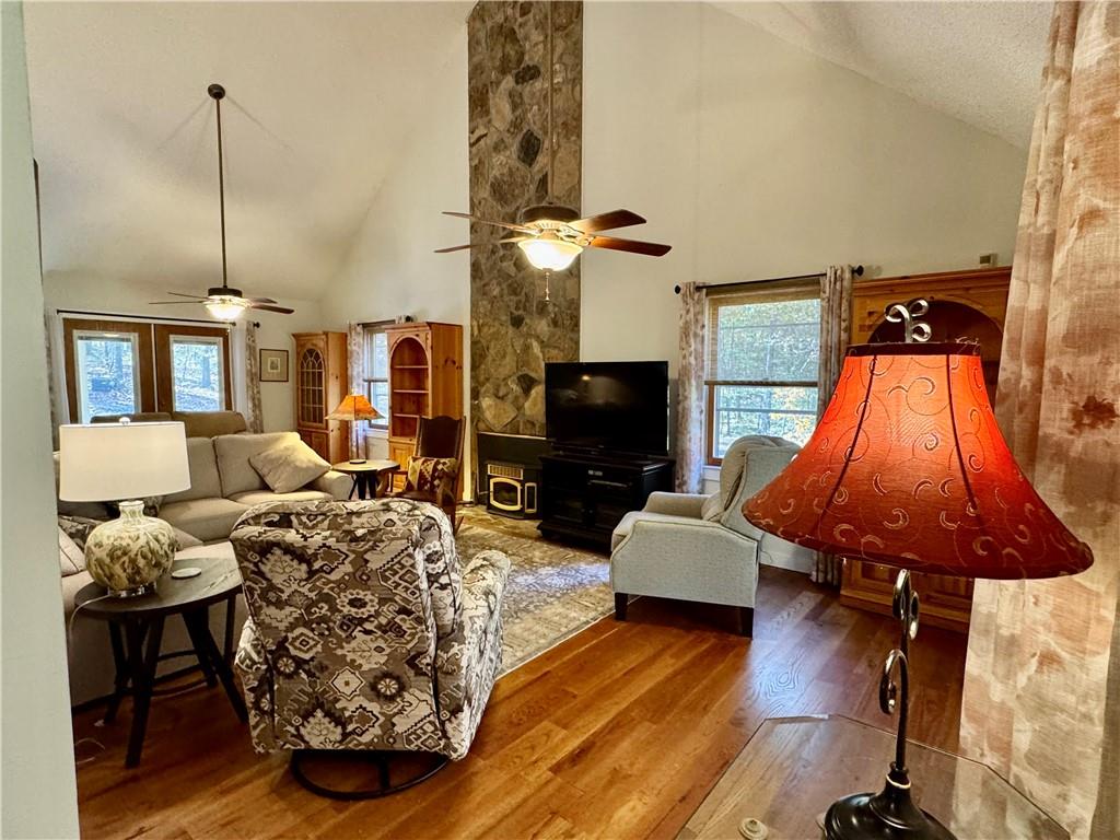 1012 King Mill Road McDonough, GA 30252 - Photo 6 of 64 a living room with furniture a flat screen tv and a fireplace