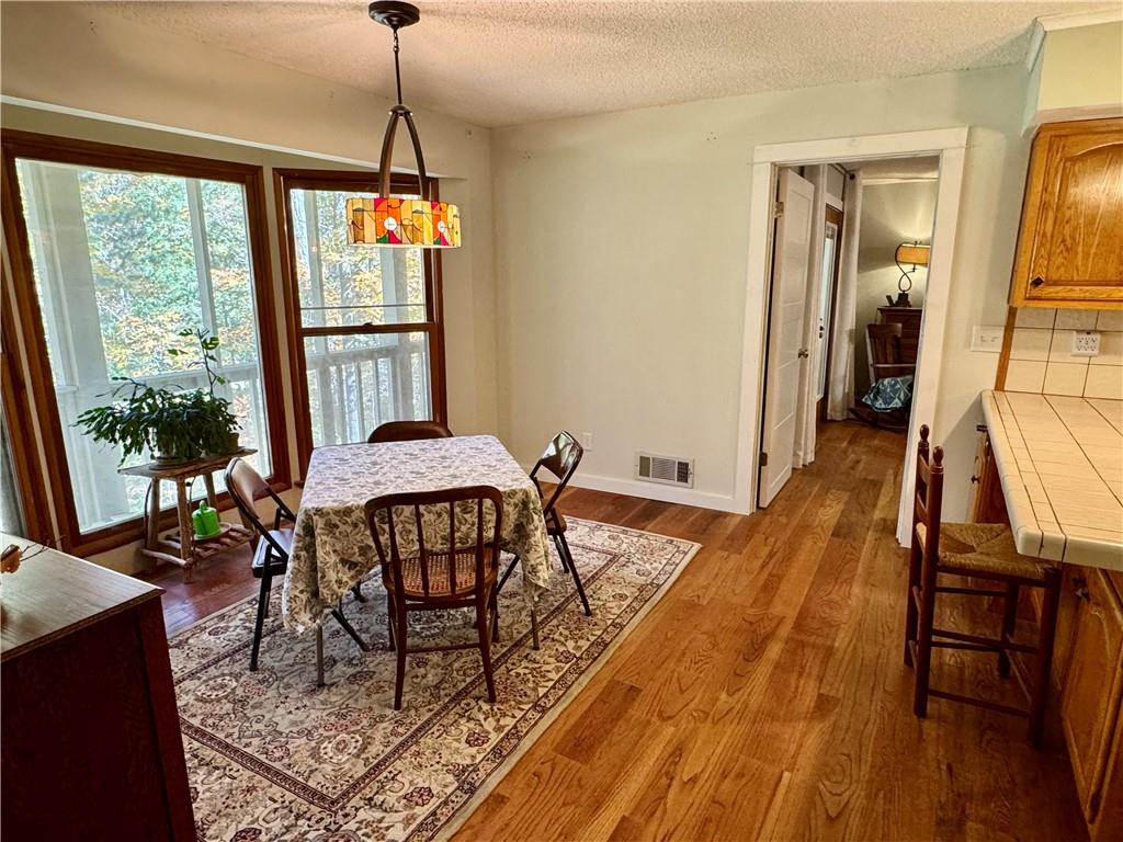 1012 King Mill Road McDonough, GA 30252 - Photo 8 of 64 a dining room with furniture window wooden floor
