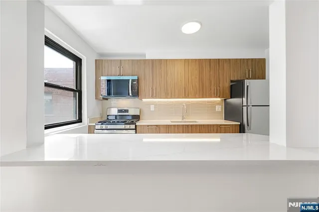 a bathroom with a bathtub and a sink