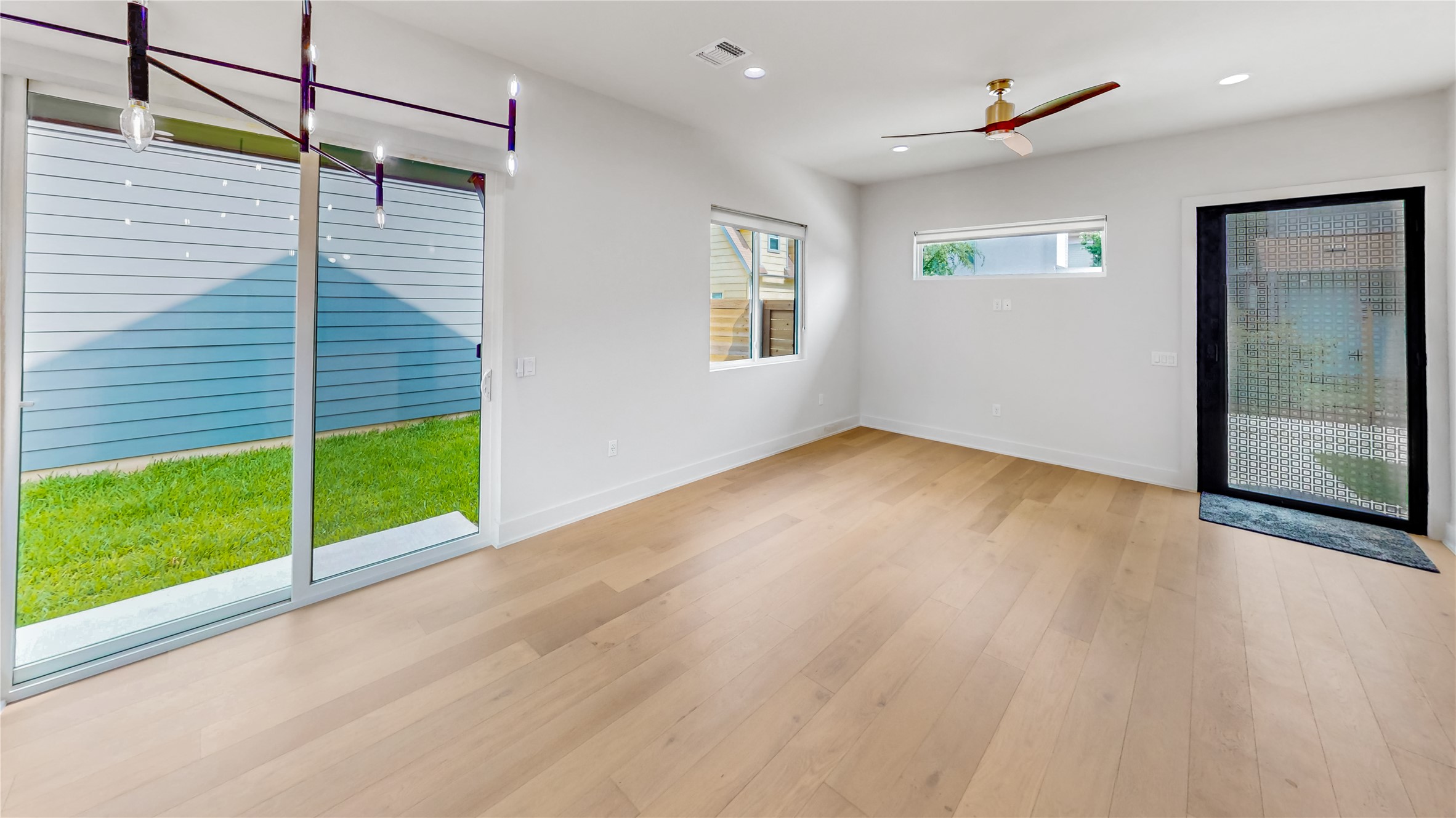 4424 Hank Avenue, Unit 2 Austin, TX 78745 - Photo 3 of 11 Clean lines define this bright room with a verdant outdoor view.