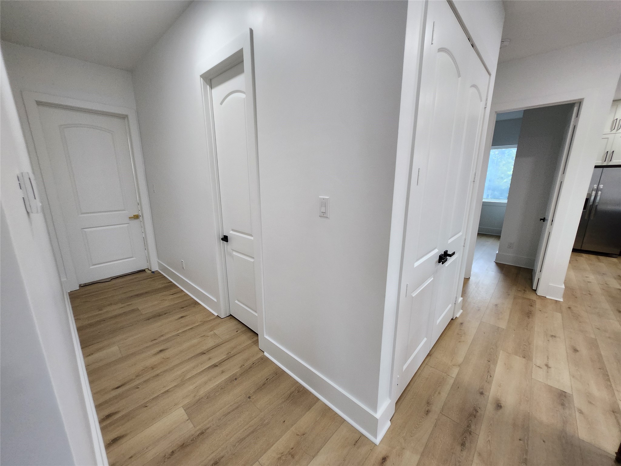 207 Carl Street Houston, TX 77009 - Photo 12 of 14 a view of a hallway with wooden floor and staircase
