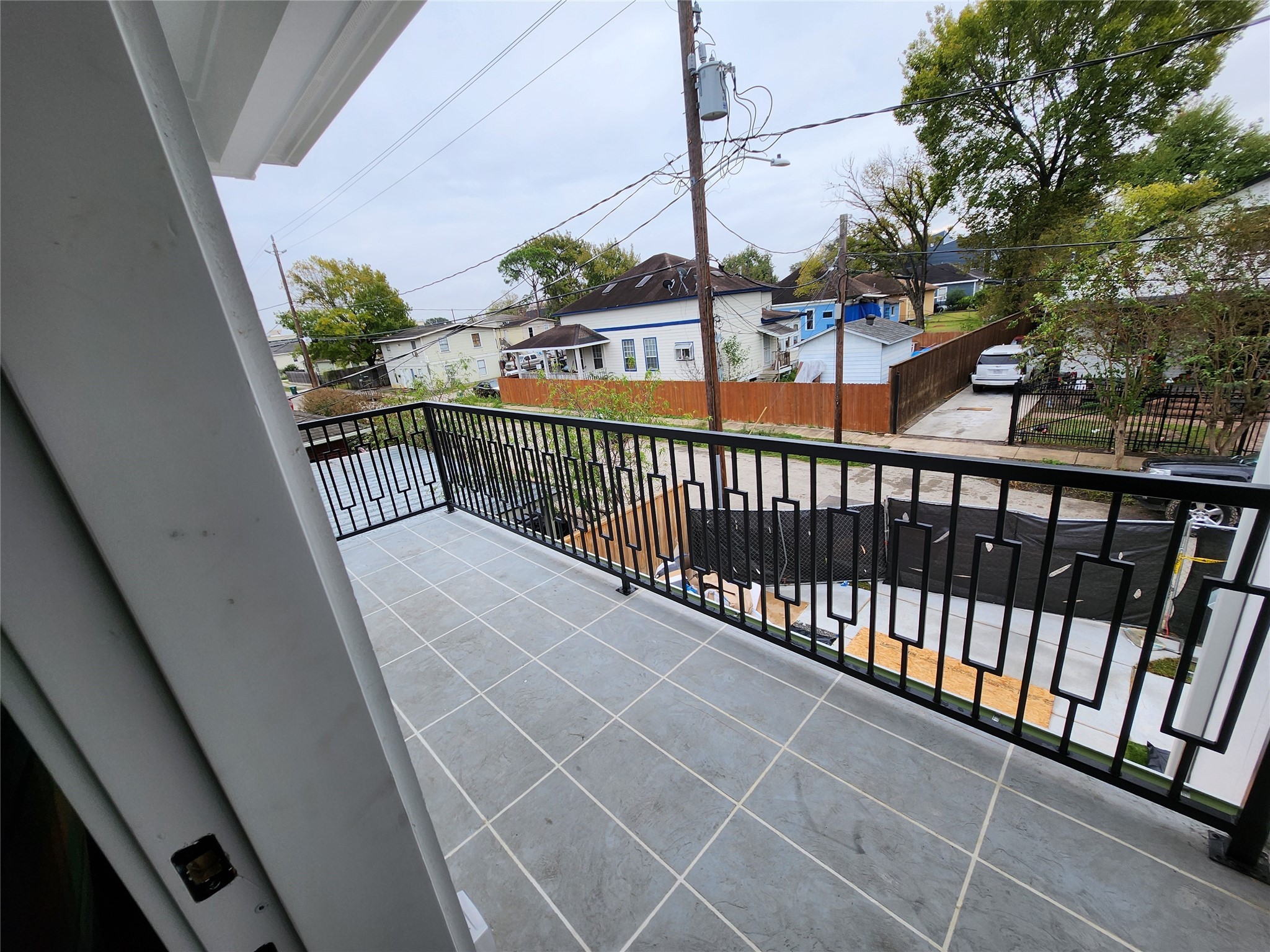 207 Carl Street Houston, TX 77009 - Photo 14 of 14 a view of balcony with car parked