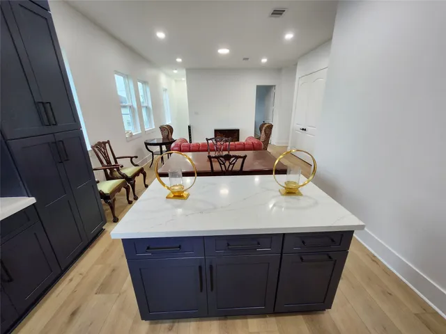 a bed room with a bed and a dresser