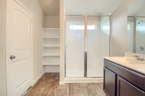 a bathroom with a sink toilet and shower