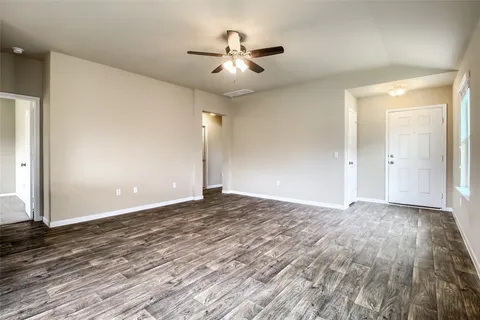 a kitchen with stainless steel appliances granite countertop a stove a refrigerator and a sink