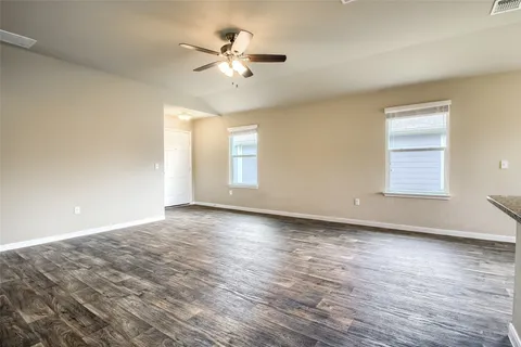 a kitchen with stainless steel appliances granite countertop a refrigerator stove and oven