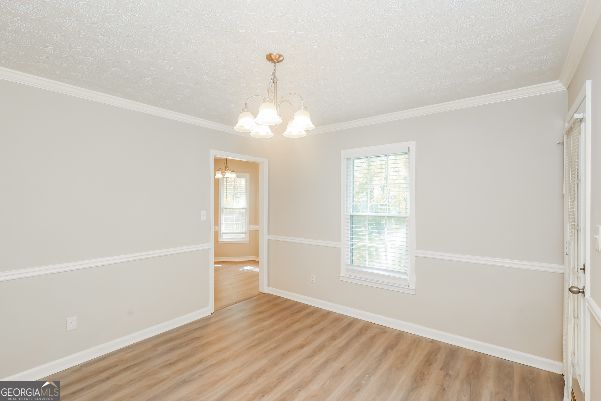 9183 Snipe Lane Jonesboro, GA 30236 - Photo 6 of 22 a view of livingroom with hardwood floor and window