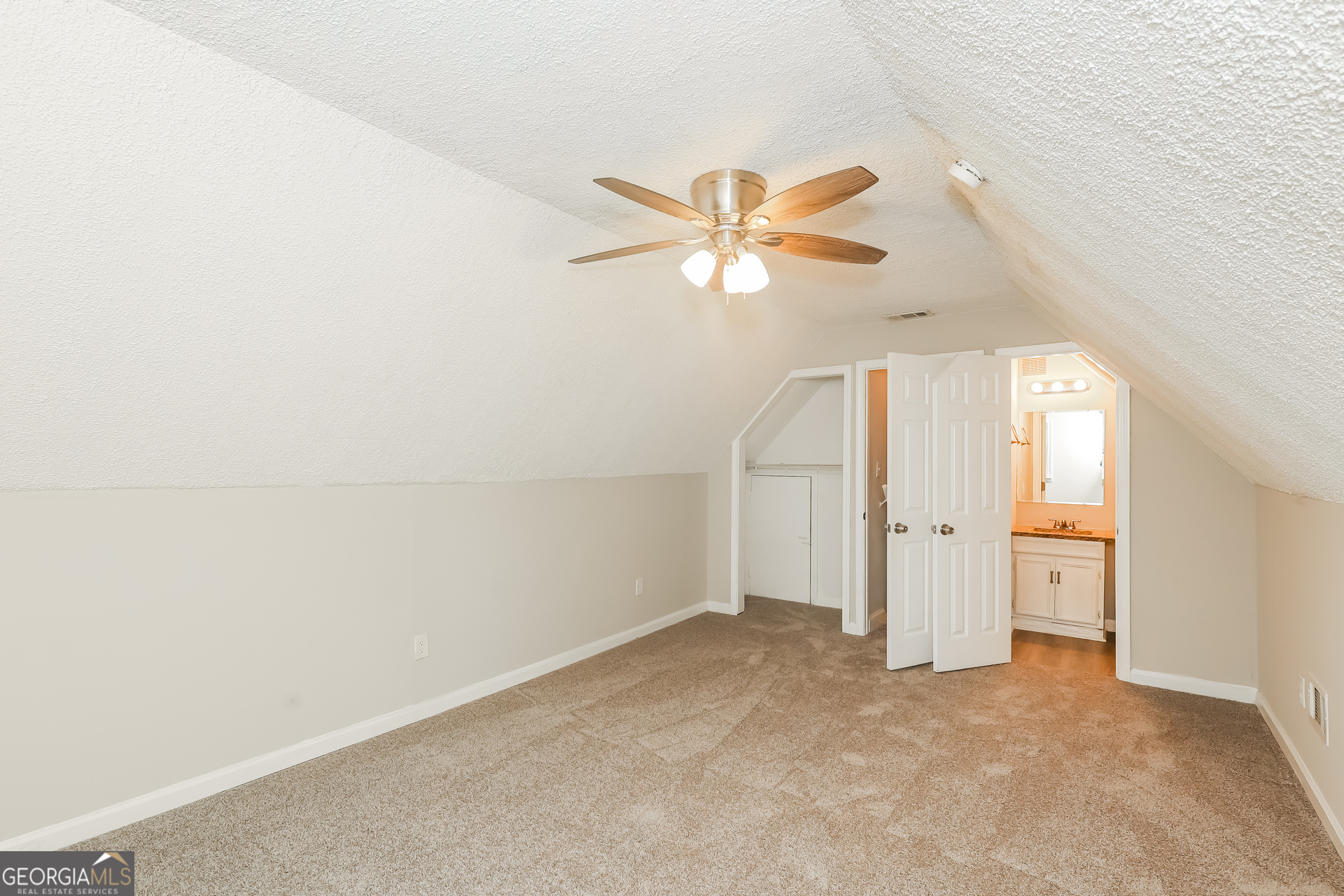 9183 Snipe Lane Jonesboro, GA 30236 - Photo 10 of 22 an empty room with a ceiling fan and a window