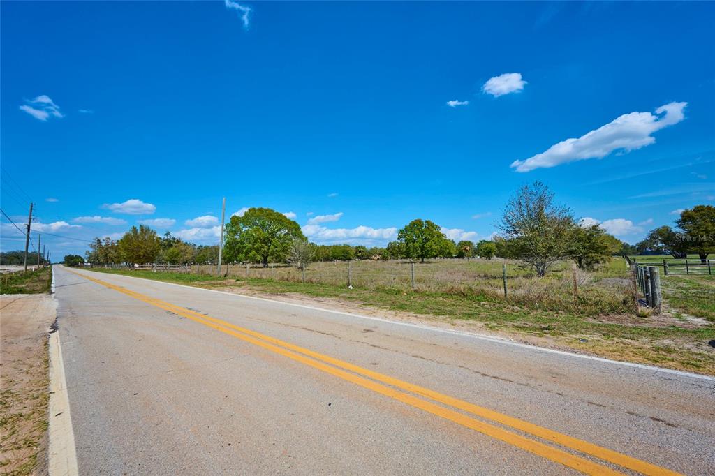 386 Capps Road Lake Wales, FL 33898 - Photo 3 of 13 a view of a lake and a yard