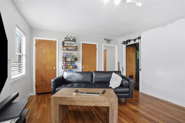 a kitchen with a sink stainless steel appliances a refrigerator and cabinets
