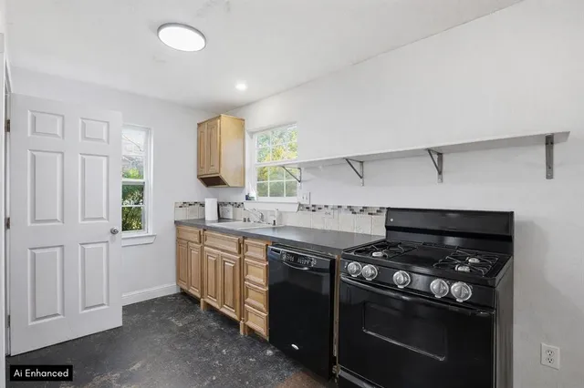 a view of a house with backyard porch and sitting area