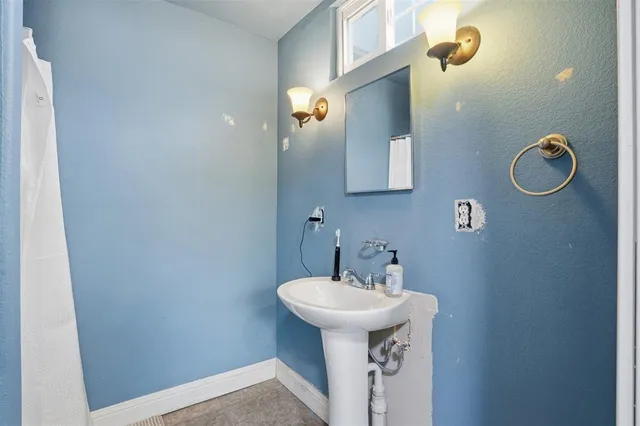 an aerial view of residential building with parking space