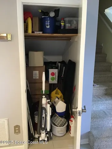 a living room with dryer and washer