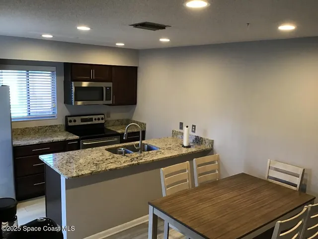 a kitchen with a stove and a microwave