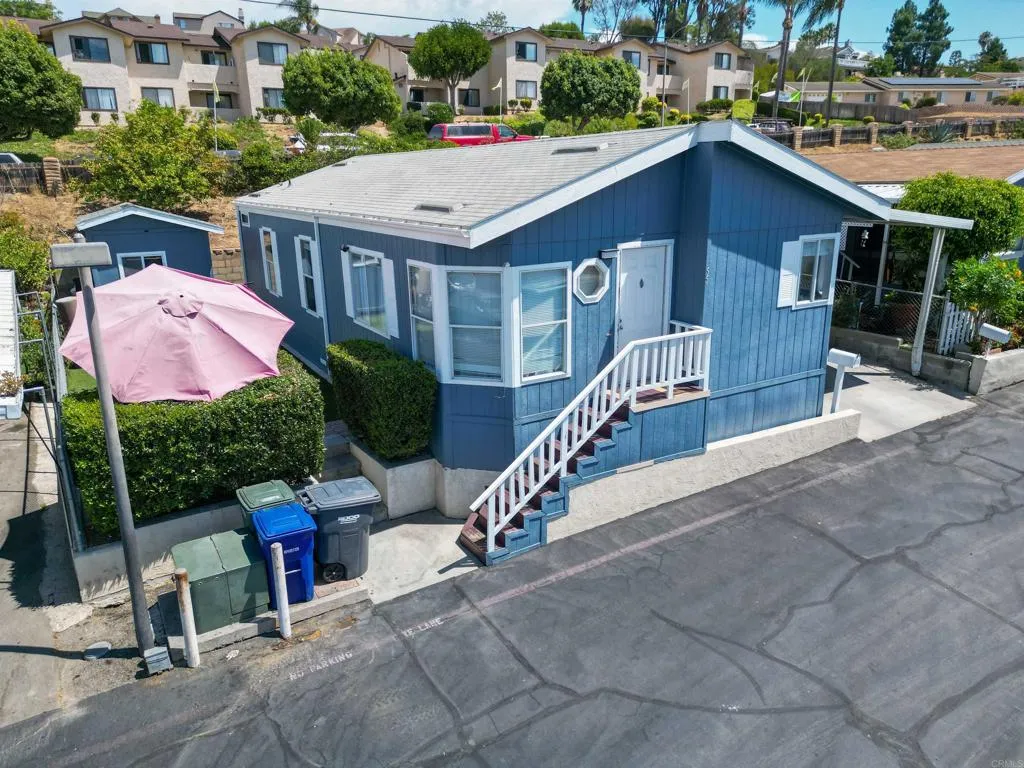 1455 Alturas Street, Unit 55 Fallbrook, CA 92028 - Photo 29 of 31 a aerial view of a house with a yard and potted plants
