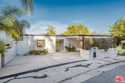 front view of a house with a patio
