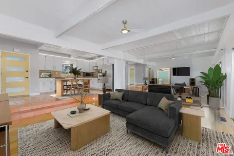 a living room with furniture and a table