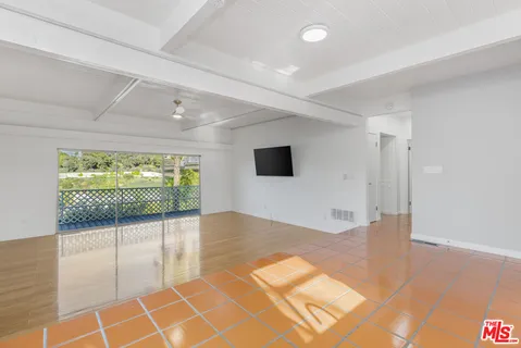 a view of livingroom with floor to ceiling window and wooden floor