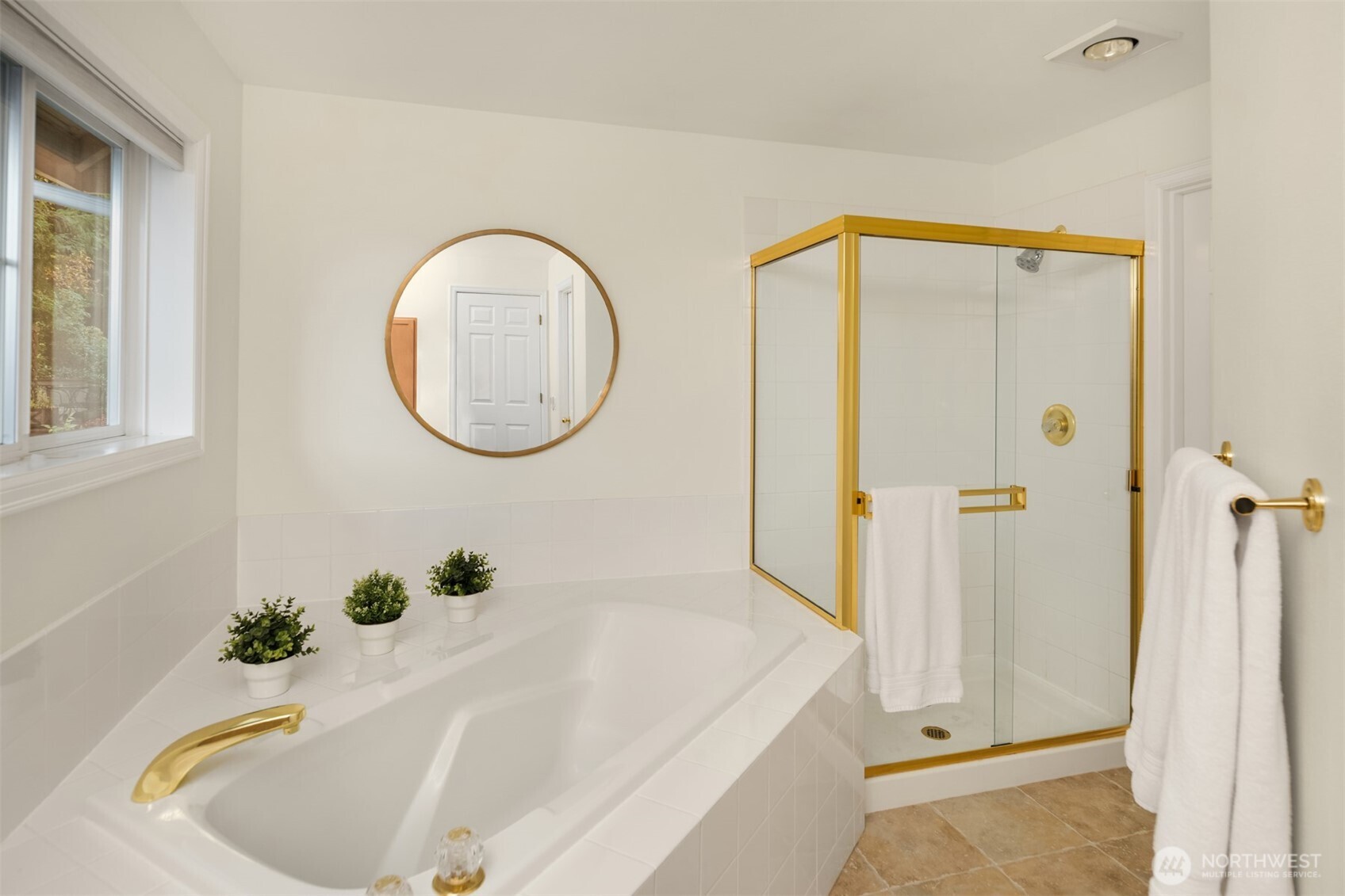 10330 Northeast 151st Place Bothell, WA 98011 - Photo 22 of 38 a bathroom with a tub and shower
