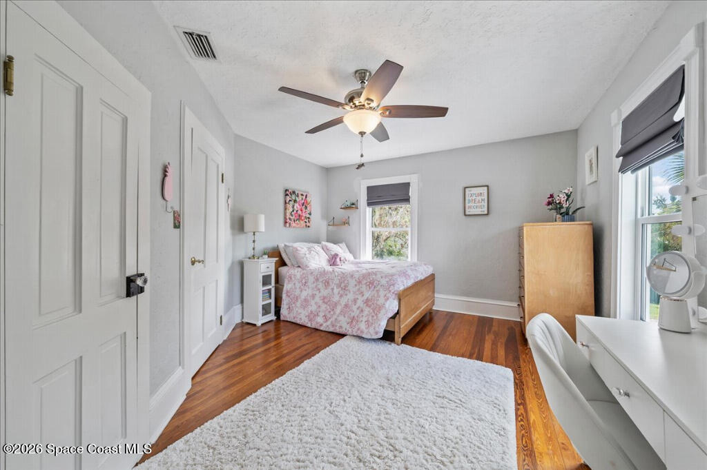 1110 Riverside Drive Titusville, FL 32780 - Photo 28 of 50 a bedroom with furniture and a window