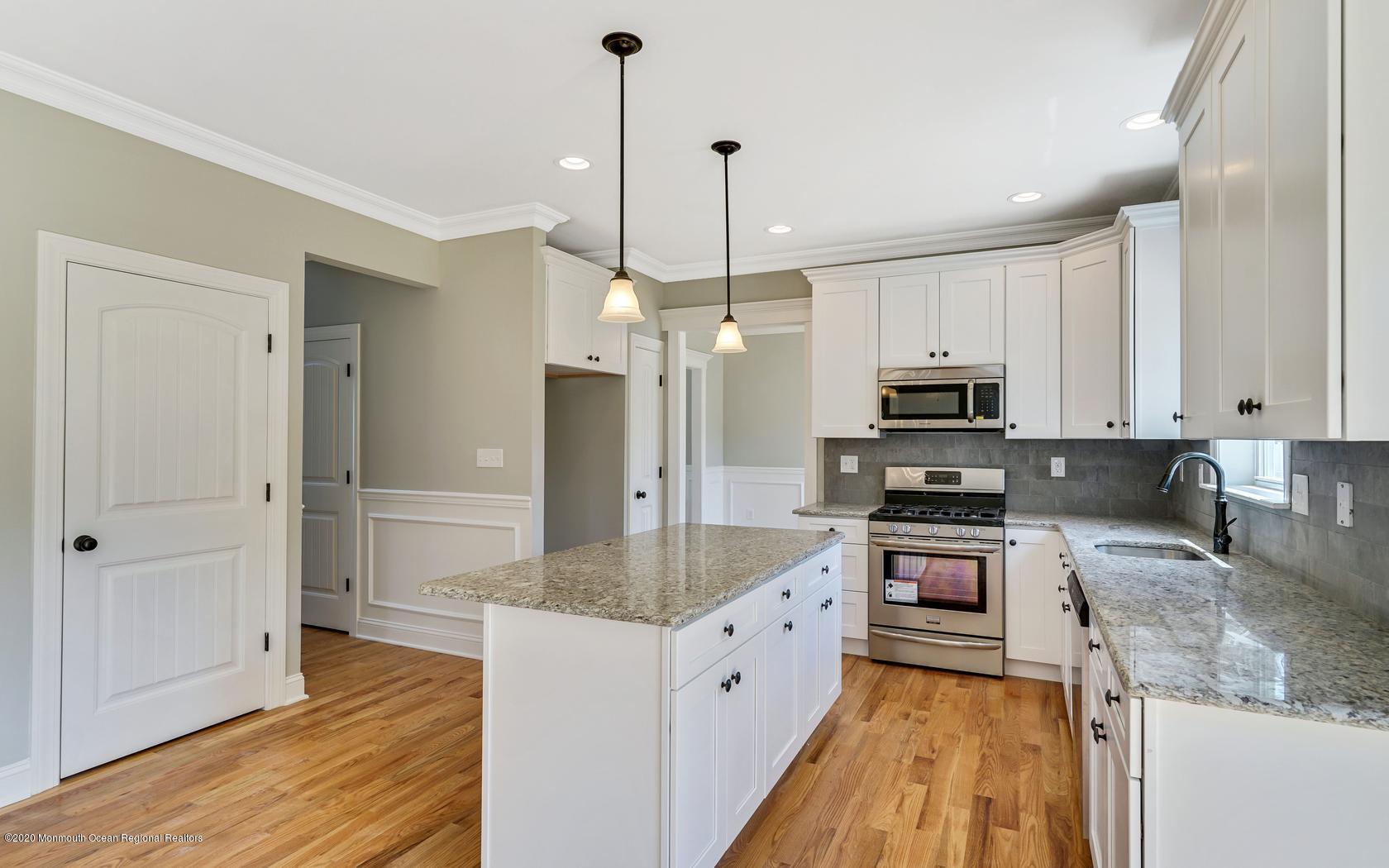 615 Ivanhoe Road Brick, NJ 08723 - Photo 11 of 28 a kitchen with stainless steel appliances granite countertop a sink refrigerator and cabinets