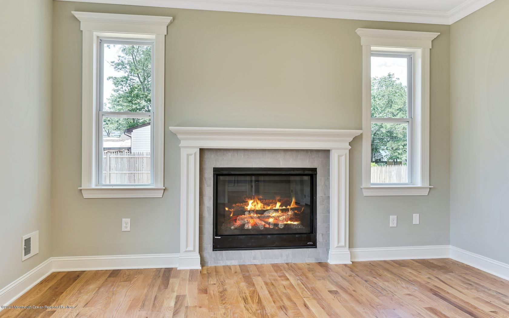 615 Ivanhoe Road Brick, NJ 08723 - Photo 14 of 28 a view of a livingroom with a fireplace and window