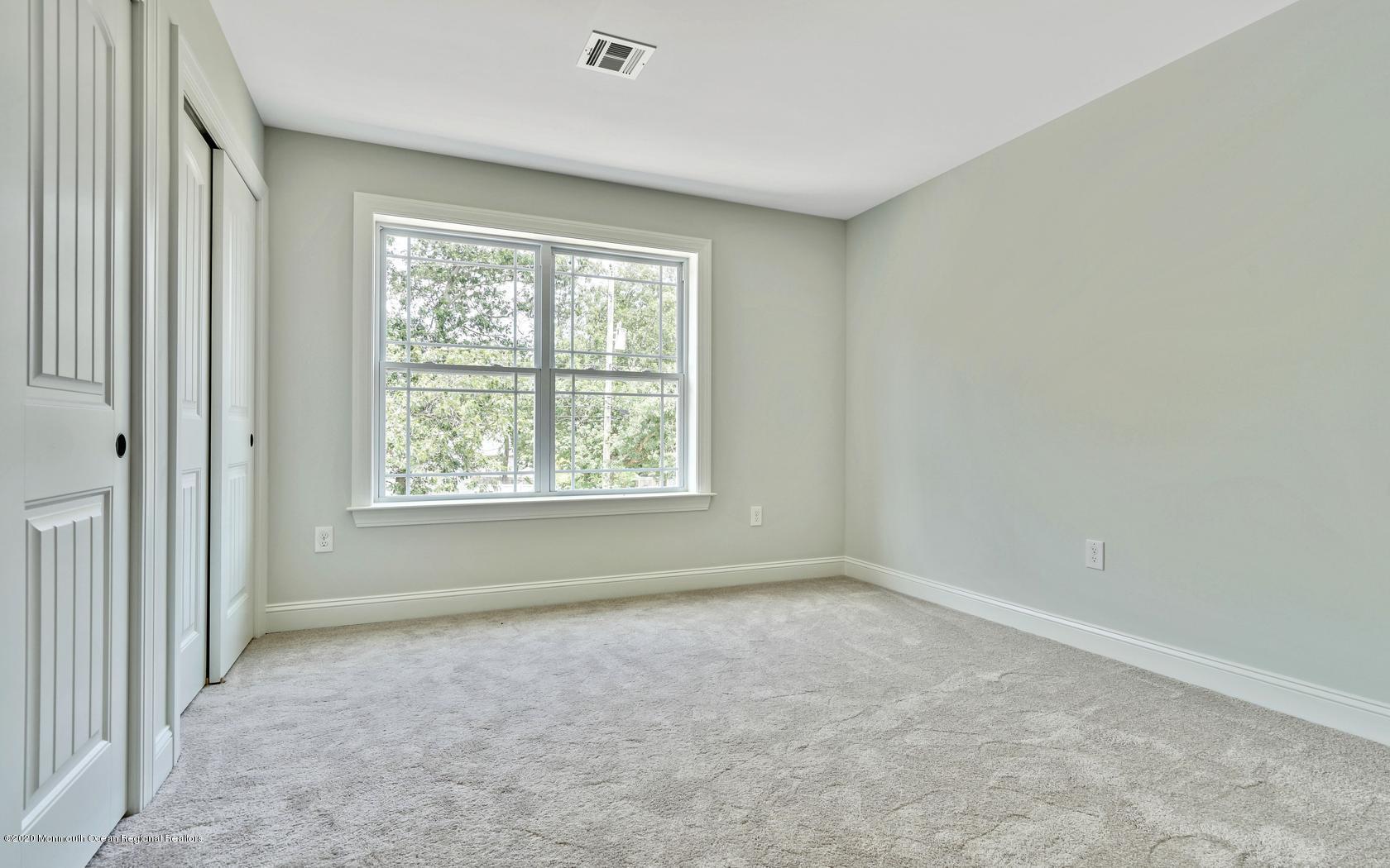 615 Ivanhoe Road Brick, NJ 08723 - Photo 17 of 28 an empty room with windows