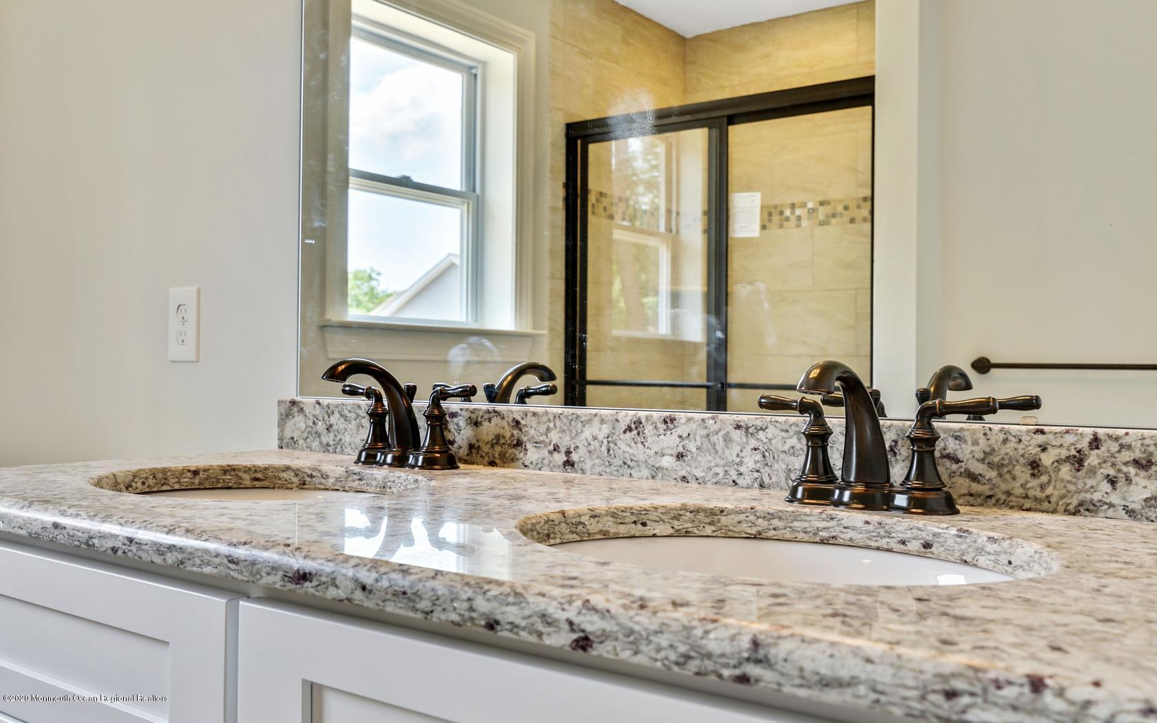 615 Ivanhoe Road Brick, NJ 08723 - Photo 26 of 28 a bathroom with sink and a mirror
