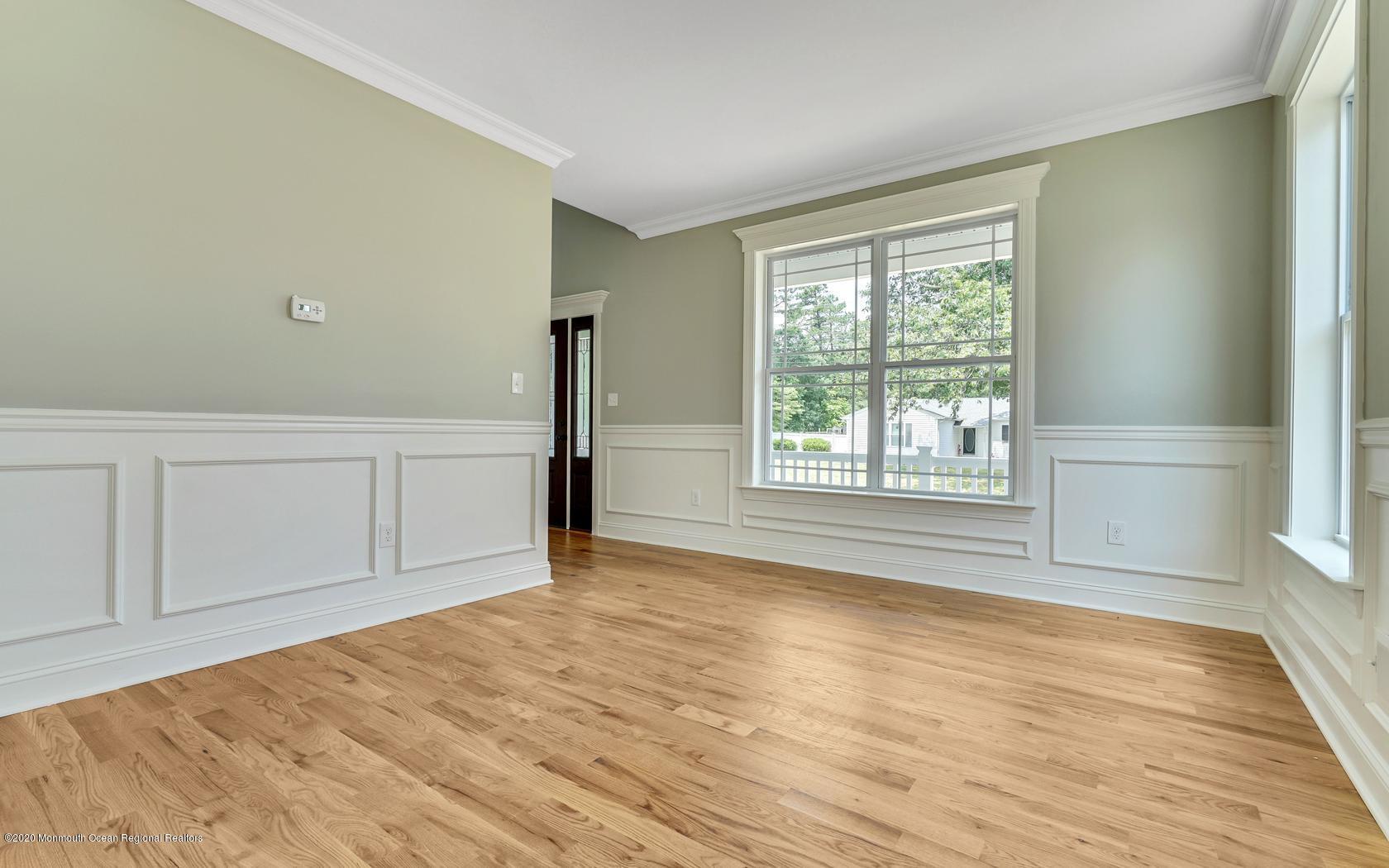 615 Ivanhoe Road Brick, NJ 08723 - Photo 5 of 28 a view of an empty room with wooden floor and a window