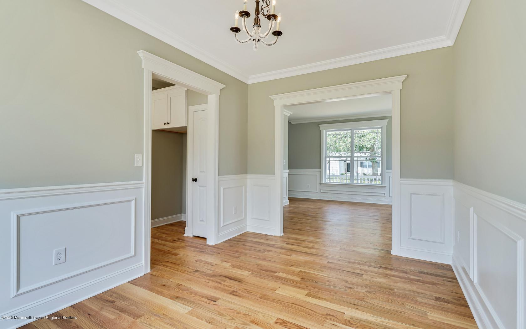 615 Ivanhoe Road Brick, NJ 08723 - Photo 7 of 28 wooden floor in an empty room with a window