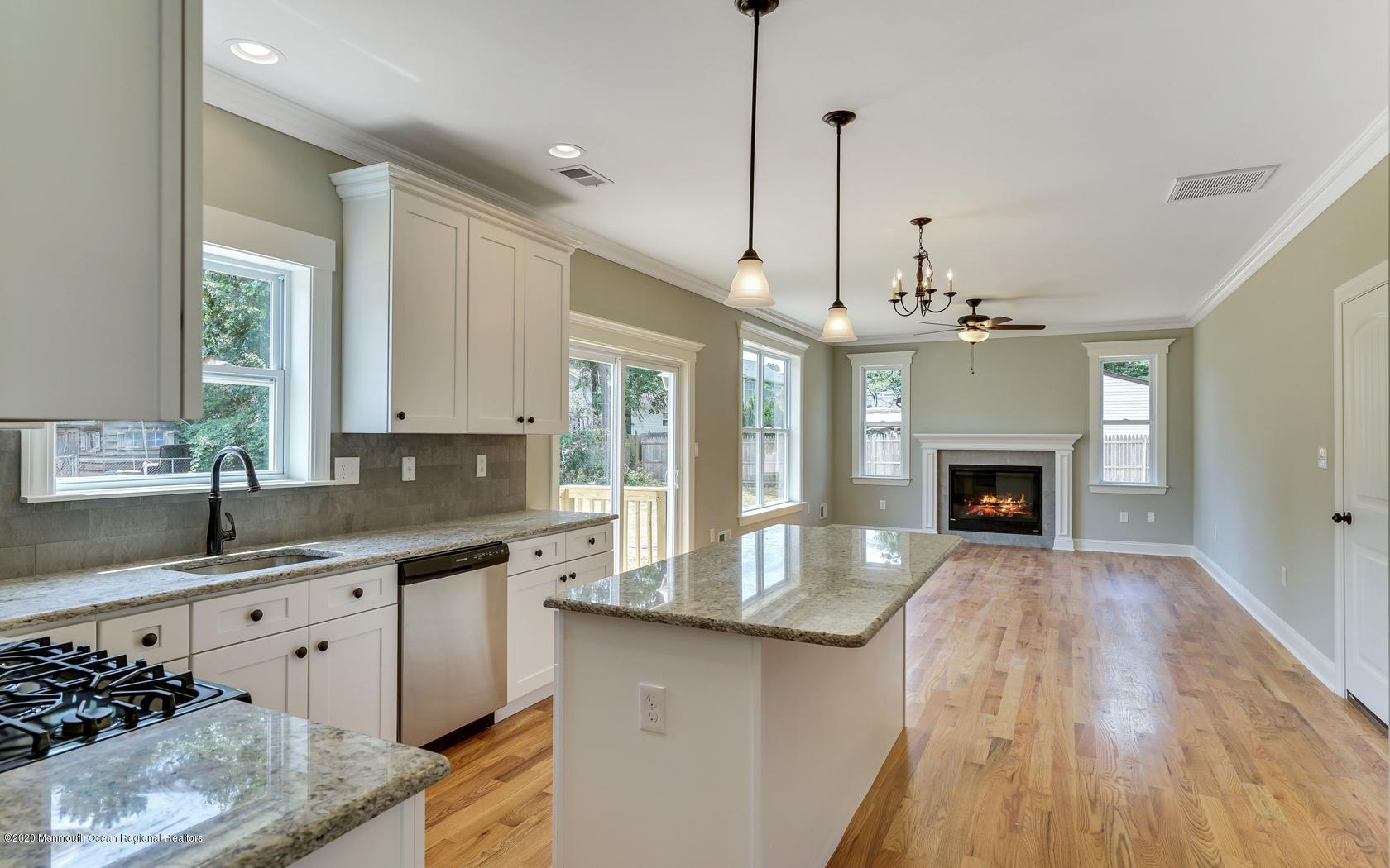 615 Ivanhoe Road Brick, NJ 08723 - Photo 8 of 28 a kitchen with stainless steel appliances granite countertop a sink a stove top oven a counter space and cabinets