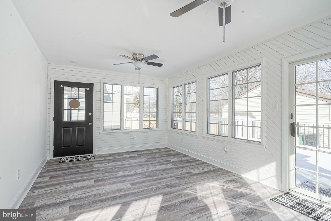 155 Cedar Avenue Pitman, NJ 08071 - Photo 19 of 41 a view of an empty room with a window and wooden floor