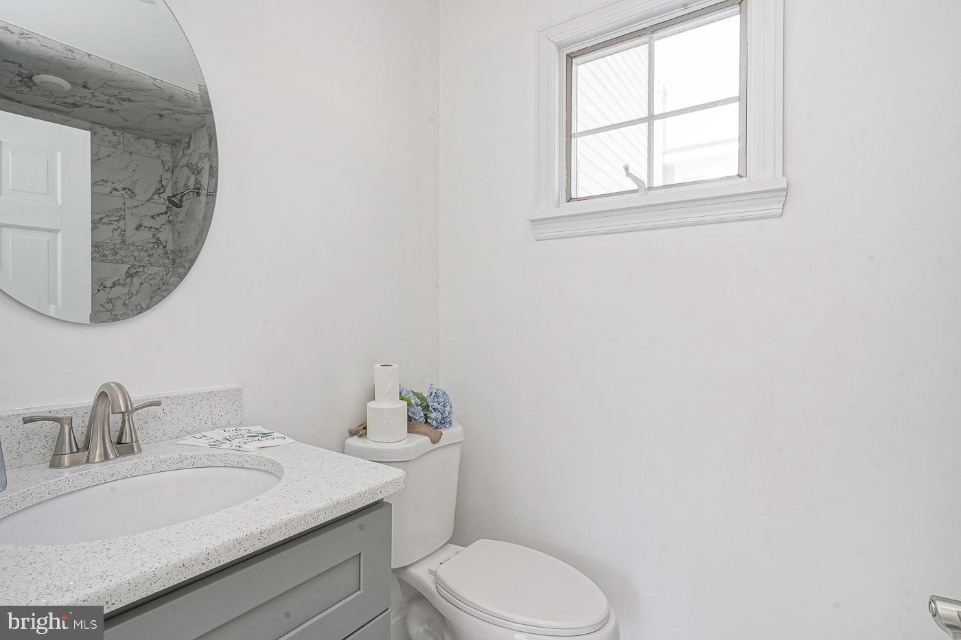 155 Cedar Avenue Pitman, NJ 08071 - Photo 20 of 41 a bathroom with a toilet a sink and a mirror