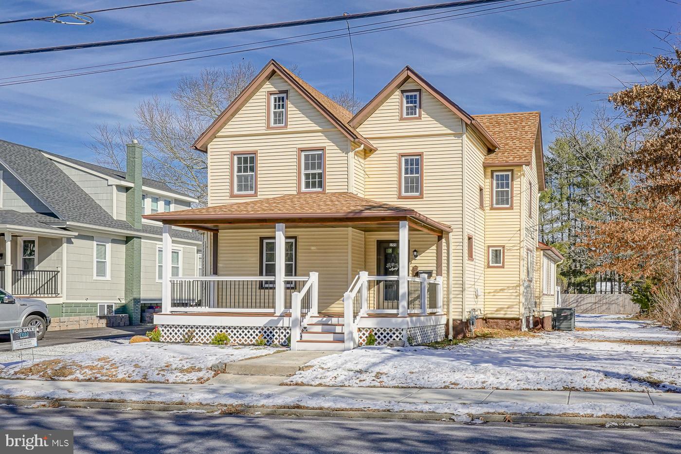 155 Cedar Avenue Pitman, NJ 08071 - Photo 2 of 41 a view of a white house with large windows next to a road