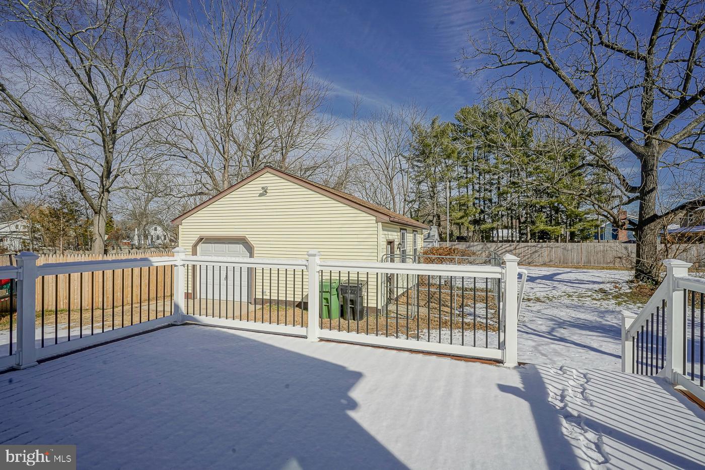 155 Cedar Avenue Pitman, NJ 08071 - Photo 39 of 41 a view of a house with a wooden deck next to a yard
