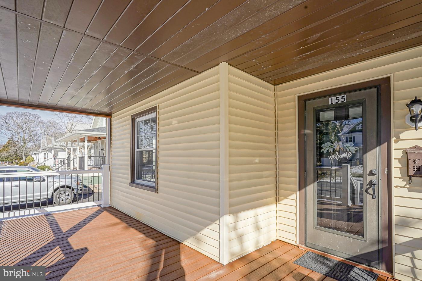 155 Cedar Avenue Pitman, NJ 08071 - Photo 4 of 41 a view of a patio with wooden floor and iron stairs