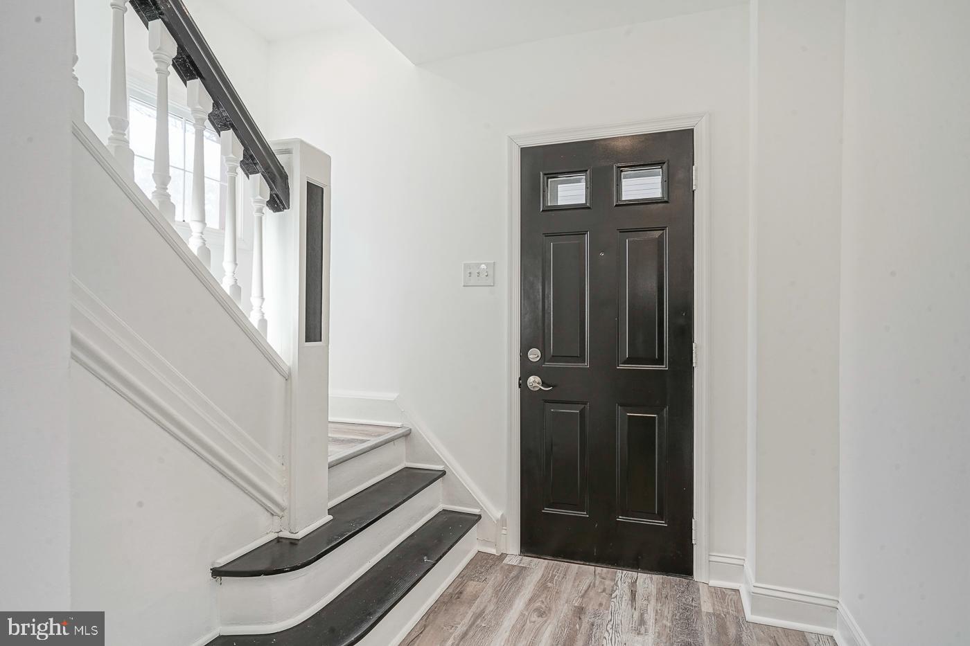 155 Cedar Avenue Pitman, NJ 08071 - Photo 6 of 41 a view of a hallway with wooden floor and staircase