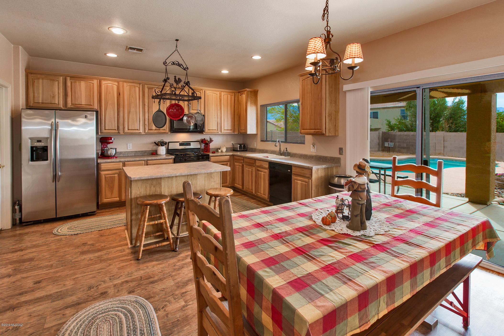 3600 East Mecate Road Tucson, AZ 85739 - Photo 14 of 39 a kitchen with a dining table and chairs