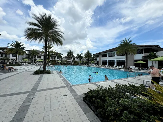 a view of multiple houses with a yard