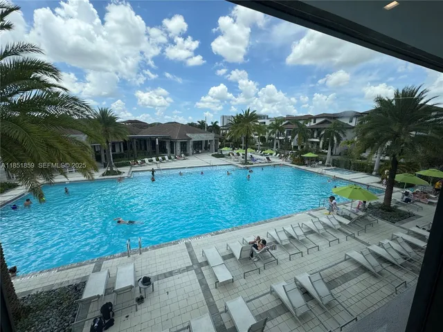 a view of swimming pool with seating space