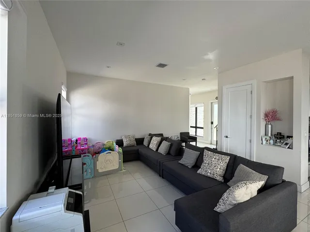 a living room with furniture and a couch