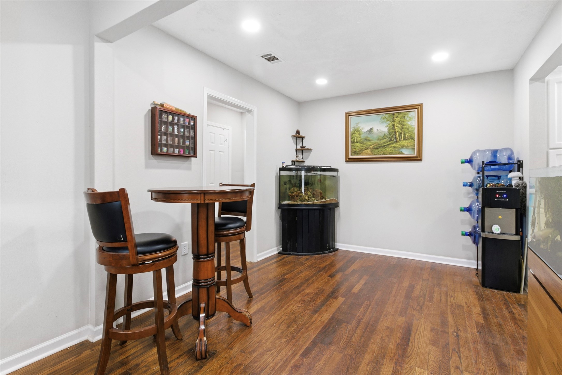 306 Center Street Pasadena, TX 77506 - Photo 8 of 31 a view of a workspace with furniture and wooden floor