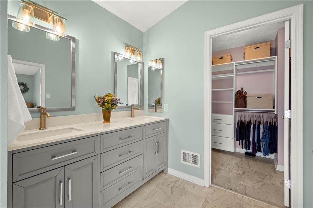 602 Birch Court Bridgeville, PA 15017 - Photo 28 of 47 a en suite bathroom with a double vanity sink and a mirror
