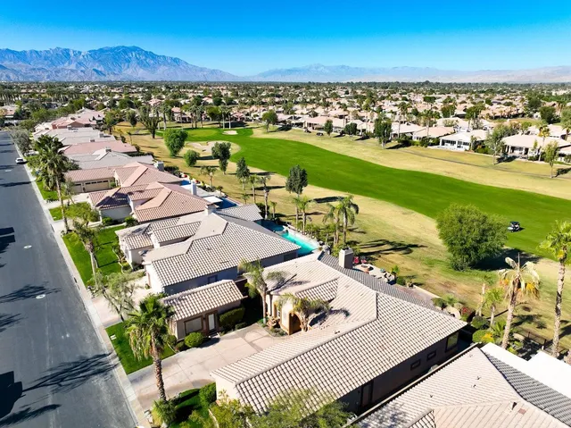 an aerial view of a house with outdoor space