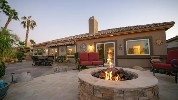 a front view of house with outdoor seating