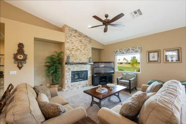 a living room with furniture and a fireplace