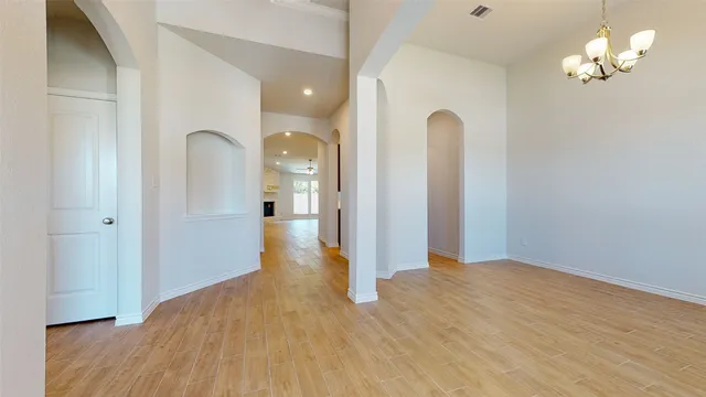 a view of a room with wooden floor and bathroom